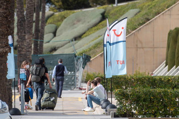 20210401 Tourists arrive at Palma de Mallorca Airport PALMA, SPAIN - APRIL 1 2021 : Tourists arriving in the TUI transfer Area at Palma de Mallorca Ariport at - Tourists arrive at Palma de Mallorca Airport on April 1, 2021 in Palma, .