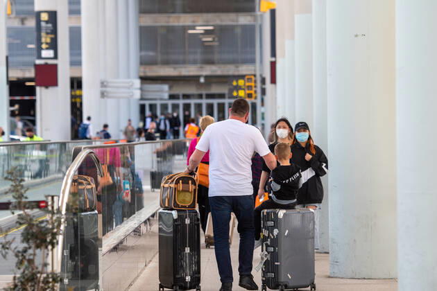 20210401 Tourists arrive at Palma de Mallorca Airport PALMA, SPAIN - APRIL 1 2021 : Tourists at Palma de Mallorca Ariport at - Tourists arrive at Palma de Mallorca Airport on April 1, 2021 in Palma, .