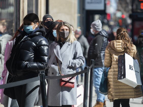 April 2, 2021, Montreal, PQ, Canada: People wear face masks as they wait to enter a store in Montreal, Friday, April 2, 2021, as the COVID-19 pandemic continues in Canada and around the world. Montreal Canada - ZUMAc35_ 20210402_zaf_c35_002 Copyright: xGrahamxHughesx