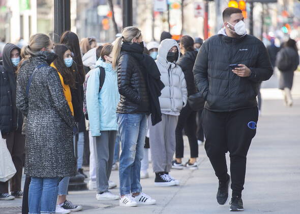 April 2, 2021, Montreal, PQ, Canada: People wear face masks as they wait to enter a store in Montreal, Friday, April 2, 2021, as the COVID-19 pandemic continues in Canada and around the world. Montreal Canada - ZUMAc35_ 20210402_zaf_c35_007 Copyright: xGrahamxHughesx