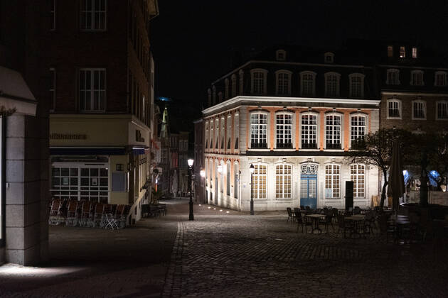 Like an abandoned city. Aachen on Easter vigil between 10 p.m. and 11 p.m. The brightly lit Couven Museum stands out from the dark alleys, in Aachen on April 3, 2021. GERMANY - AACHEN - EASTER Easter 2021 Covid Pandemic