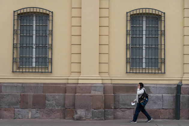 April 4, 2021, Santiago, Metropolitana, Chile: A man with a mask walks in the almost empty streets of Santiago, in the middle of the total quarantine decreed last week for the Metropolitan Region. Santiago Chile - ZUMAb332 20210404_zip_b332_025 Copyright: xMatiasxBasualdox