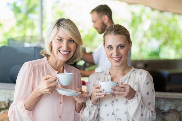 Portrait of smiling friends enjoying coffee together Portrait of smiling friends enjoying coffee together at restaurant, model released, , property released, Cape Town, South Africa, 21.11.2016, 928474.jpg, restaurant, coffee shop, hotel, food and drink industry, retail, business, customer, casual clothing, standing, holding, smiling, cheerful, happy, coffee, coffee cup, saucer, drink, beverage, refreshment, friend, friendship, enjoyment, joy, fun, confident, confidence, together, bonding, beautiful, attractive, pretty, leisure, lifestyle