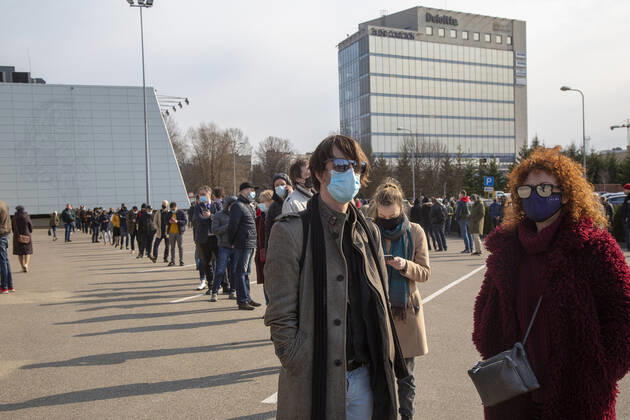 (210417) -- RIGA, April 17, 2021 -- People line up to enter a mass immunization center for COVID-19 in Riga, Latvia, on April 16, 2021. Latvia on Friday opened a mass immunization center for non-prioritized people in a bid to ramp up vaccinations against COVID-19, health authorities informed. (Photo by Xinhua) LATVIA-VACCINATION-COVID-19 EdijsxPalens