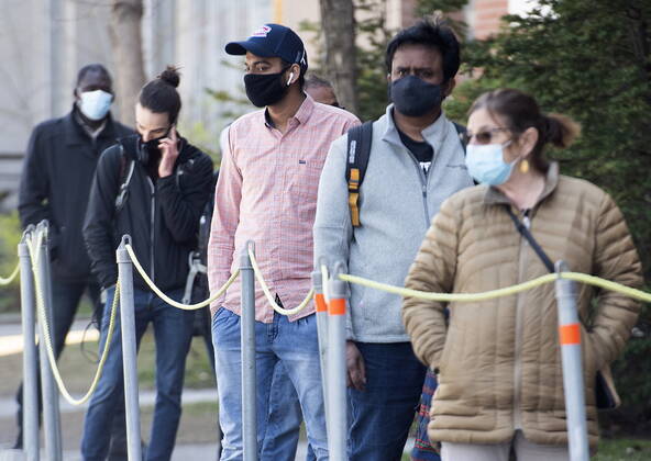 April 24, 2021, Montreal, PQ, Canada: People wear face masks as they wait to be tested for COVID-19 at a clinic in Montreal, Saturday, April 24, 2021. Montreal Canada - ZUMAc35_ 20210424_zaf_c35_002 Copyright: xGrahamxHughesx