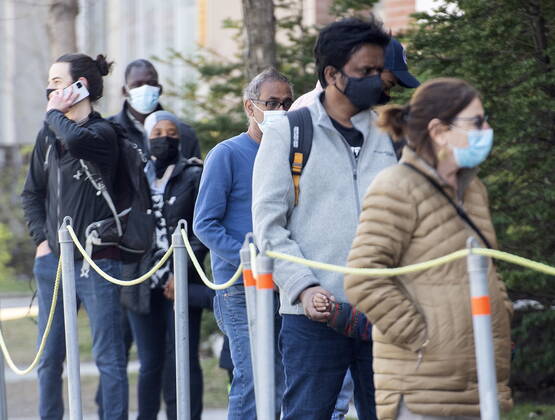 April 24, 2021, Montreal, PQ, Canada: People wear face masks as they wait to be tested for COVID-19 at a clinic in Montreal, Saturday, April 24, 2021. Montreal Canada - ZUMAc35_ 20210424_zaf_c35_003 Copyright: xGrahamxHughesx