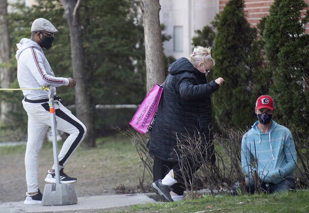 April 24, 2021, Montreal, PQ, Canada: People wear face masks as they wait to be tested for COVID-19 at a clinic in Montreal, Saturday, April 24, 2021. Montreal Canada - ZUMAc35_ 20210424_zaf_c35_004 Copyright: xGrahamxHughesx