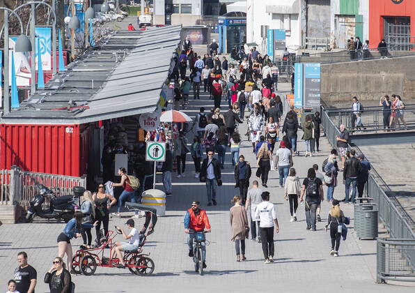 April 24, 2021, Montreal, PQ, Canada: People walk in the Old Port on a warm spring day in Montreal, Saturday, April 24, 2021, as the COVID-19 pandemic continues in Canada and around the world. Montreal Canada  - ZUMAc35_ 20210424_zaf_c35_039 Copyright: xGrahamxHughesx