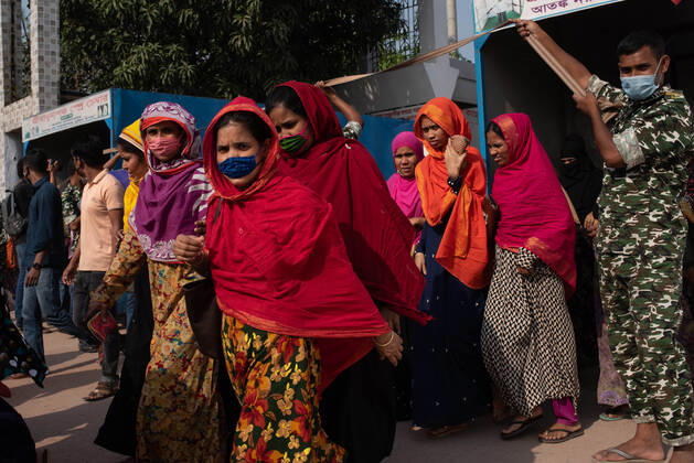 April 25, 2021, Dhaka, Bangladesh: Garment workers leave their workplace after doing their jobs during the lockdown. The Government announced the garments sector and the export sector were outside the purview of lockdown. Dhaka Bangladesh - ZUMAj162 20210425_zip_j162_002 Copyright: xFatima-TujxJohorax