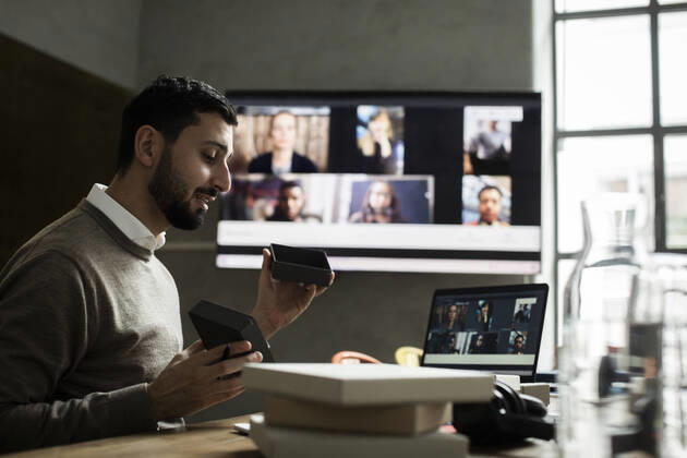 Male entrepreneur explaining about product to customers through video conference on laptop in office Sweden, Stockholm, model released, property released Copyright: xMaskotx , MA85849