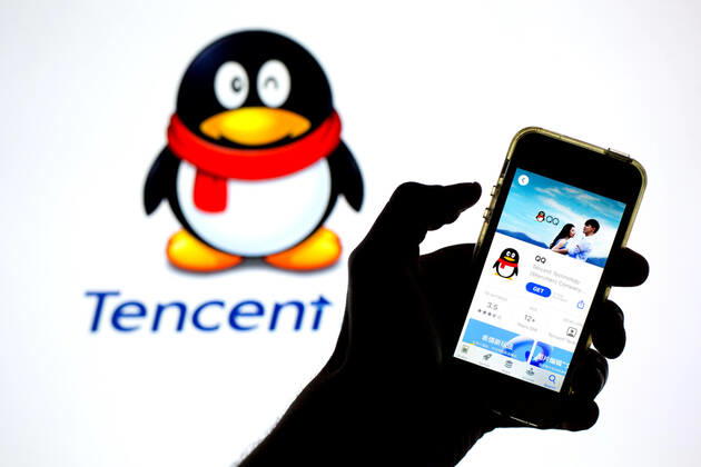 April 30, 2021, Barcelona, Catalonia, Spain: In this photo illustration, the Tencent QQ app in App Store seen displayed on a smartphone screen and a Tencent QQ Desktop on a laptop in the background. Barcelona Spain - ZUMAd159 20210430_zia_d159_023 Copyright: xThiagoxPrudenciox