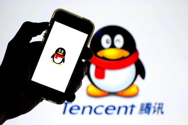 April 30, 2021, Barcelona, Catalonia, Spain: In this photo illustration, the Tencent QQ app seen displayed on a smartphone screen and a Tencent QQ logo in the background. Barcelona Spain - ZUMAd159 20210430_zia_d159_024 Copyright: xThiagoxPrudenciox