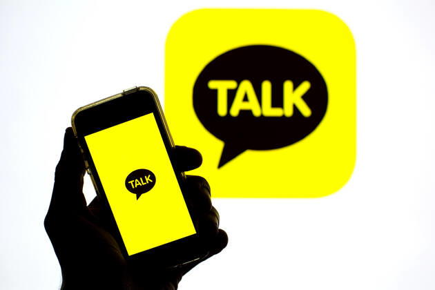 April 30, 2021, Barcelona, Catalonia, Spain: In this photo illustration, the KakaoTalk app seen displayed on a smartphone screen and a KakaoTalk logo in the background. Barcelona Spain - ZUMAd159 20210430_zia_d159_025 Copyright: xThiagoxPrudenciox