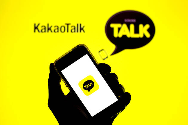 April 30, 2021, Barcelona, Catalonia, Spain: In this photo illustration, the KakaoTalk app seen displayed on a smartphone screen and a KakaoTalk logo in the background. Barcelona Spain - ZUMAd159 20210430_zia_d159_029 Copyright: xThiagoxPrudenciox