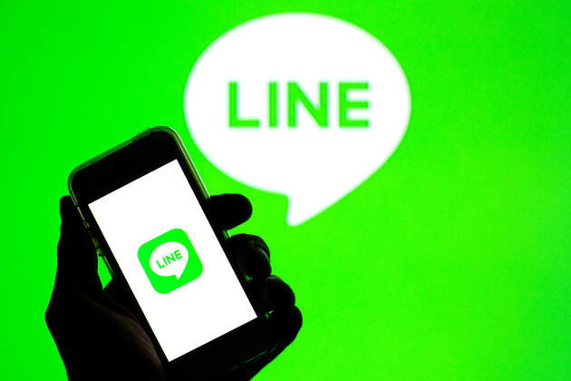 April 30, 2021, Barcelona, Catalonia, Spain: In this photo illustration, the Line app seen displayed on a smartphone screen and a Line logo in the background. Barcelona Spain - ZUMAd159 20210430_zia_d159_016 Copyright: xThiagoxPrudenciox