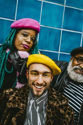 Portrait of smiling young man with friends wearing berets Berlin, Germany, model released Copyright: xMaskotx , MA86607