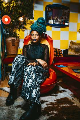 Full length of mid adult woman sitting on chair in living room Berlin, Germany, model released, property released Copyright: xMaskotx , MA86648