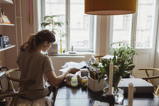 Rear view of female entrepreneur working at home office Sweden, Stockholm, model released, property released Copyright: xMaskotx , MA86943