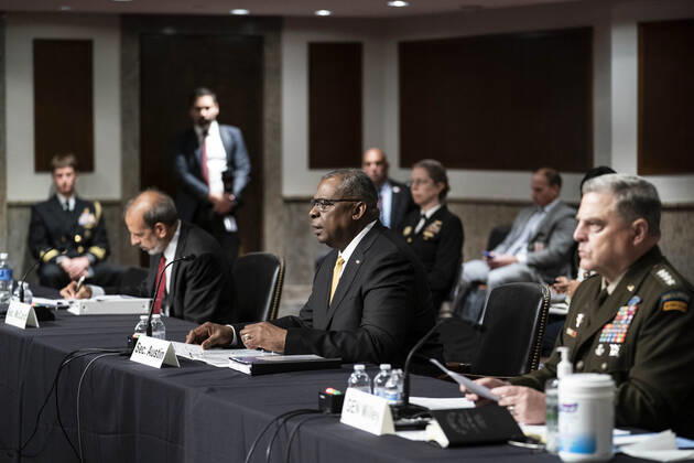 U.S. Secretary of Defense General Lloyd Austin, center, and Chairman of the Joint Chiefs of Staff Gen. Mark Milley, right, testify before the Senate Armed Services Committee at the U.S. Capitol in Washington DC, on Thursday, June 10, 2021. The committee heard testimony the Defense Department budget posture in review of the Defense Authorization Request for FY2022.  WAP20210610569 SARAHxSILBIGER