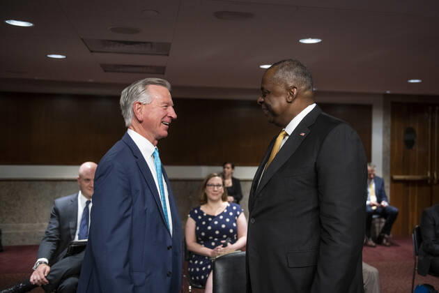 June 10, 2021, Washington, District of Columbia, USA: US Secretary of Defense Lloyd Austin III, right, is greeted by United States Senator Tommy Tuberville (Republican of Alabama), left, during a Senate Committee on Armed Services hearing to examine the Department of Defense budget posture in review of the Defense Authorization Request for fiscal year 2022, in the Dirksen Senate Office Building in Washington, DC, Thursday, June 10, 2021. Credit: Rod Lamkey CNP Washington USA - ZUMAs152 20210610_zaa_s152_154 Copyright: xRodxLamkeyx-xCnpx