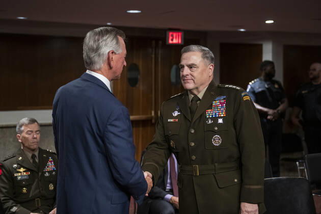 General Mark Milley, Chairman of the Joint Chiefs of Staff, right, is greeted by United States Senator Tommy Tuberville (Republican of Alabama), left, as he appears at a Senate Committee on Armed Services hearing to examine the Department of Defense budget posture in review of the Defense Authorization Request for fiscal year 2022, in the Dirksen Senate Office Building in Washington, DC, Thursday, June 10, 2021. Copyright: xRodxLamkeyx xCNPx MediaPunchx
