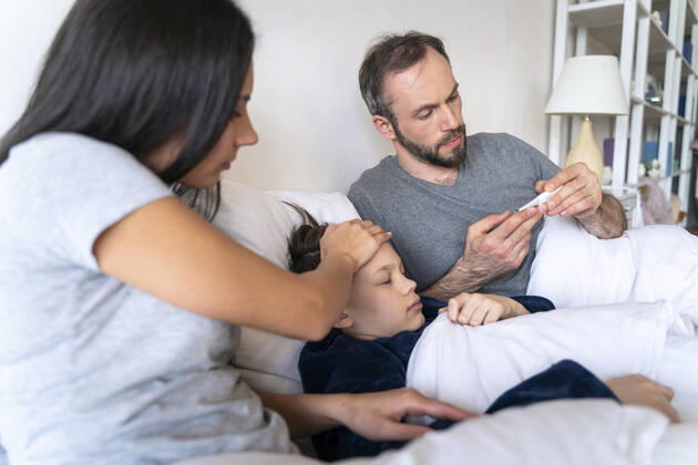 Couple taking care of ill son at home model released Symbolfoto property released OIPF00605