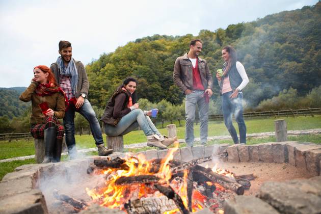 Group of people standing around campfire.  Copyright: xShyxAlxBritanni arabianEyex AP49133