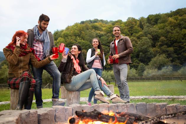 Group of people standing around campfire.  Copyright: xShyxAlxBritanni arabianEyex AP49134