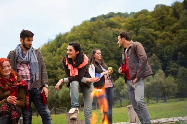 Group of people standing around campfire.  Copyright: xShyxAlxBritanni arabianEyex AP49135
