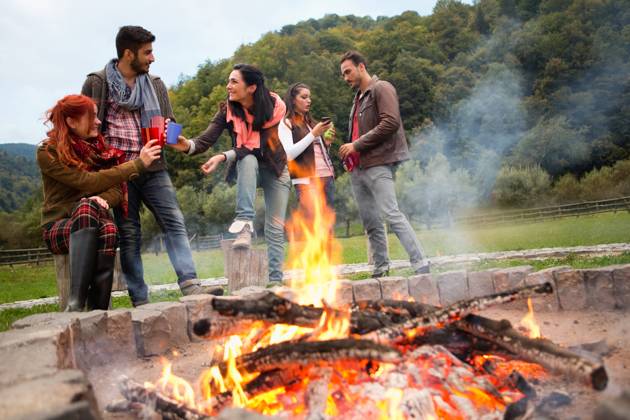 Group of people standing around campfire.  Copyright: xShyxAlxBritanni arabianEyex AP49136