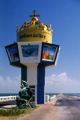 Cayo Coco, used as a hideout by buccaneers in the early colonial period, was home to a small settlement of fishermen and charcoal producers until 1955, when the freshwater supply was exhausted and the market for charcoal ended with the spread of electrification after the Cuban Revolution. A causeway connecting the island to the Cuban mainland opened on 26 July 1988, and resort construction began. Cuba: The entrance to the causeway road leading to Cayo Coco, Jardines del Rey (Gardens of the King), Ciego de Avila Province xCPAxMediaxCo.xLtd.x Copyright: xDavidxHenleyx