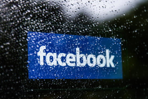 TikTok And Facebook Photo Illustrations Facebook logo displayed on a phone screen is seen through raindrops on the window in this illustration photo taken in Krakow, Poland on July 17, 2021. (Photo Ilustration by Jakub Porzycki NurPhoto) Krakow Poland porzycki-tiktokan210717_np6Ib Copyright: xJakubxPorzyckix