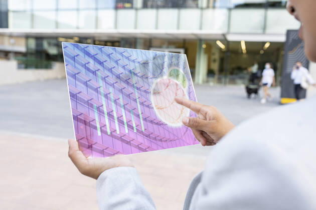 Businesswoman checking business plan on futuristic digital tablet model released Symbolfoto property released JCCMF03078