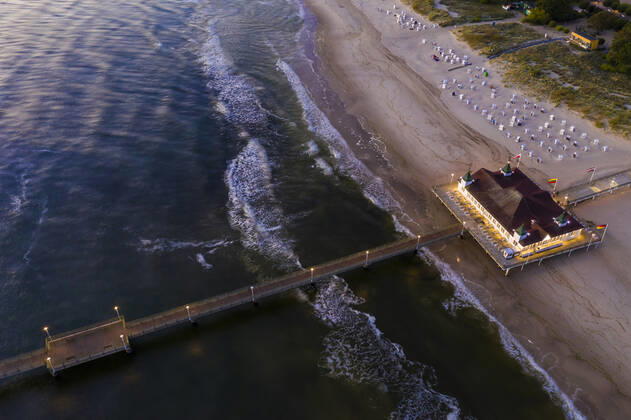 Germany, Mecklenburg-Western Pomerania, Heringsdorf, Aerial view of coastal pier at dawn WDF06364