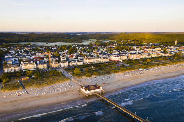 Germany, Mecklenburg-Western Pomerania, Heringsdorf, Aerial view of beach and coastal town at dawn WDF06368