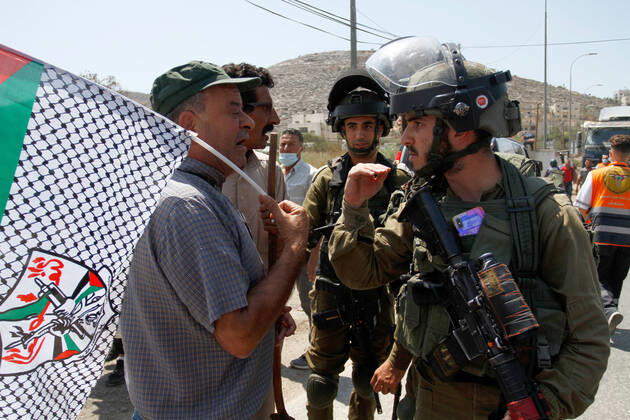 August 25, 2021, Nablus, West Bank, Palestine: Protesters chant slogans while confronting Israeli soldiers during the demonstration..Palestinians protest against the construction of a new road for Israeli settlers, and also call for the removal of the Israeli outpost Eviatar near Beita, south of Nablus in the West Bank. Nablus Palestine - ZUMAs197 20210825_zaa_s197_106 Copyright: xNasserxIshtayehx