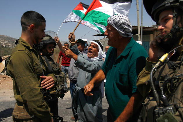 August 25, 2021, Nablus, West Bank, Palestine: Protesters chant slogans while confronting Israeli soldiers during the demonstration..Palestinians protest against the construction of a new road for Israeli settlers, and also call for the removal of the Israeli outpost Eviatar near Beita, south of Nablus in the West Bank. Nablus Palestine - ZUMAs197 20210825_zaa_s197_107 Copyright: xNasserxIshtayehx
