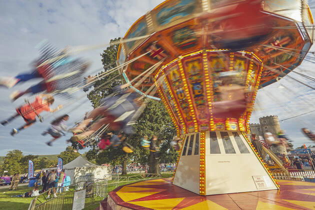 IMAGO Creative: Jahreszeit Sommer, Festivals The merry-go-round at Camp Bestival, an annual family-friendly music festival held in July, Lulworth Castle, Dorset, England, United Kingdom, Europe Copyright: NigelxHicks 1202-503 Editorial Use Only