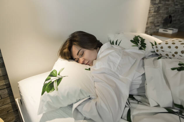 Woman sleeping in bed at home model released property released, LLUF00271
