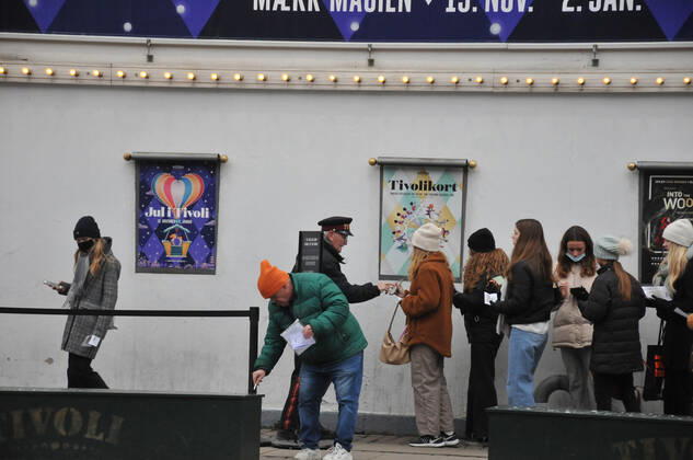Copenhagen Denmark. 07 December 2021 Tvoli garden christmas visitor showing corona passport at enterance in danis capiatl (Photo..Francis Joseph Dean Dean Pictures)