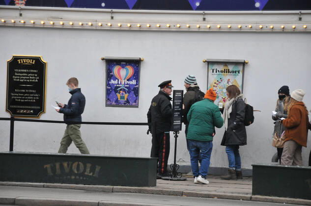 Copenhagen Denmark. 07 December 2021 Tvoli garden christmas visitor showing corona passport at enterance in danis capiatl (Photo..Francis Joseph Dean Dean Pictures)