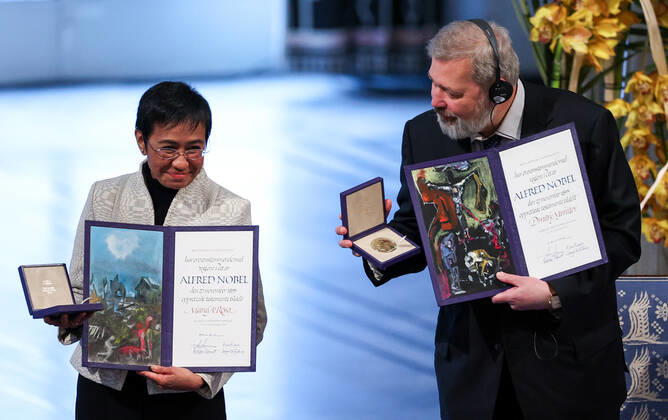 OSLO, NORWAY â€“ DECEMBER 10, 2021: Filipino-American journalist, co-founder and CEO of Rappler Maria Ressa (L) and Russian journalist, Novaya Gazeta editor-in-chief Dmitry Muratov are awarded the 2021 Nobel Peace Prize in recognition of their efforts to safeguard freedom of expression, which is a precondition for democracy and lasting peace , at a ceremony at Oslo City Hall. Sergei Bobylev TASS  TS11B5FE