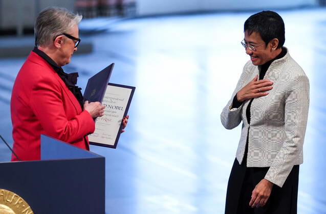 OSLO, NORWAY â€“ DECEMBER 10, 2021: Norwegian Nobel Committee Chairwoman Berit Reiss-Andersen (L) presents the 2021 Nobel Peace Prize to Filipino-American journalist, co-founder and CEO of Rappler Maria Ressa in recognition of her efforts to safeguard freedom of expression, which is a precondition for democracy and lasting peace , at a ceremony at Oslo City Hall. Sergei Bobylev TASS  TS11B5FB