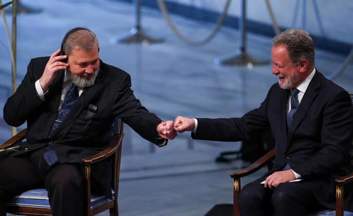 OSLO, NORWAY â€“ DECEMBER 10, 2021: 2021 Nobel Peace Prize winner, Russian journalist, Novaya Gazeta editor-in-chief Dmitry Muratov (L) and 2020 Nobel Peace Prize winner, World Food Programme Executive Director David Beasley fist bump during the 2021 Nobel Peace Prize award ceremony at Oslo City Hall. The Norwegian Nobel Committee has decided to award the Nobel Peace Prize for 2021 to Maria Ressa and Dmitry Muratov in recognition of their efforts to safeguard freedom of expression, which is a precondition for democracy and lasting peace . Sergei Bobylev TASS  TS11B5FA