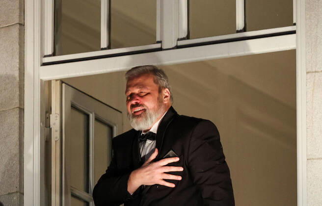 OSLO, NORWAY â€“ DECEMBER 10, 2021: Nobel Peace Prize winners, Russian journalist, Novaya Gazeta newspaper editor-in-chief Dmitry Muratov greets the participants in a torchlight parade in honour of the 2021 Nobel Peace Prize winners from a balcony of the Grand Hotel. The Norwegian Nobel Committee has decided to award the Nobel Peace Prize for 2021 to Filipino-American journalist, co-founder and CEO of Rappler Maria Ressa and Russian journalist, Novaya Gazeta editor-in-chief Dmitry Muratov in recognition of their efforts to safeguard freedom of expression, which is a precondition for democracy and lasting peace . Sergei Bobylev TASS  TS11B694