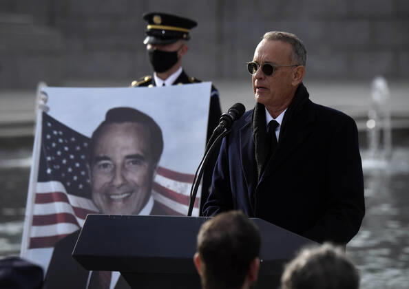 December 10, 2021, Washington, DC, USA: TOM HANKS speaks as mourners pay respects to the late Senator Bob Dole (R-KS) as the hearse makes a stop at a ceremony at the World War II Memorial in Washington DC on December 10, 2021. Washington USA - ZUMAg208 20211210_zap_g208_050 Copyright: xCarolxGuzyx