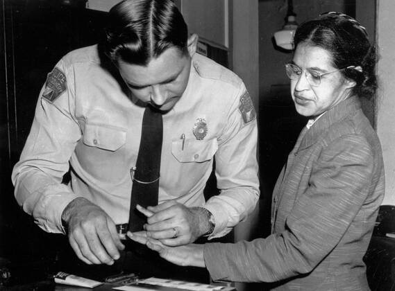 December 17, 2021, Michigan, USA: In this Feb. 22, 1956, file photo, Rosa Parks is fingerprinted by police Lt. D.H. Lackey in Montgomery, Ala. after she was arrested. . AP In this Feb. 22, 1956, file photo, Rosa Parks is fingerprinted by police Lt. D.H. Lackey in Montgomery, Ala. after she was charged with violating segregation laws with dozens of other bus boycott protesters. Michigan USA - ZUMAf31_ 20211217_zaf_f31_004 Copyright: xGenexHerrickx