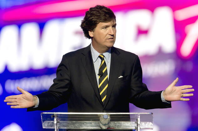 December 19, 2021 - Phoenix, Arizona, USA - Fox News host TUCKER CARLSON speaks at AmericaFest, a Turning Point USA event. Phoenix USA - ZUMAce6_ 20211219_zaf_ce6_003 Copyright: xBrianxCahnx