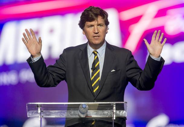 December 19, 2021 - Phoenix, Arizona, USA - Fox News host TUCKER CARLSON speaks at AmericaFest, a Turning Point USA event. Phoenix USA - ZUMAce6_ 20211219_zaf_ce6_006 Copyright: xBrianxCahnx