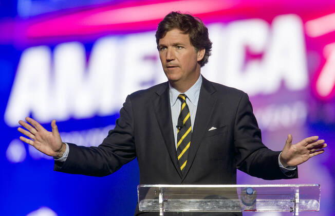 December 19, 2021 - Phoenix, Arizona, USA - Fox News host TUCKER CARLSON speaks at AmericaFest, a Turning Point USA event. Phoenix USA - ZUMAce6_ 20211219_zaf_ce6_007 Copyright: xBrianxCahnx